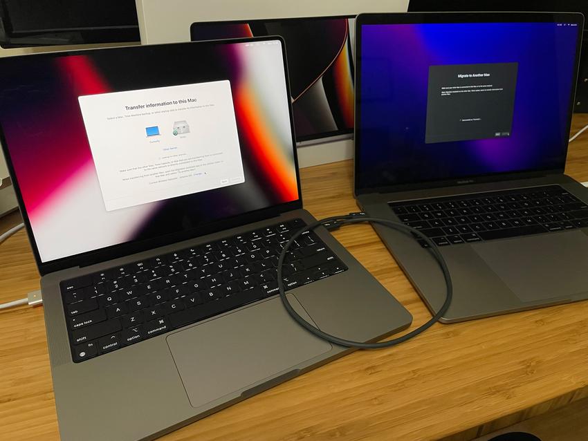 Two MacBook Pros connected with a Thunderbolt cable